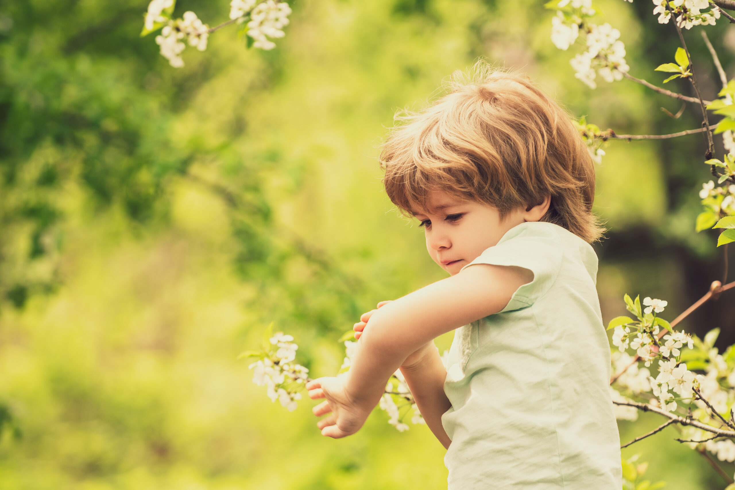 Child looking at their arm