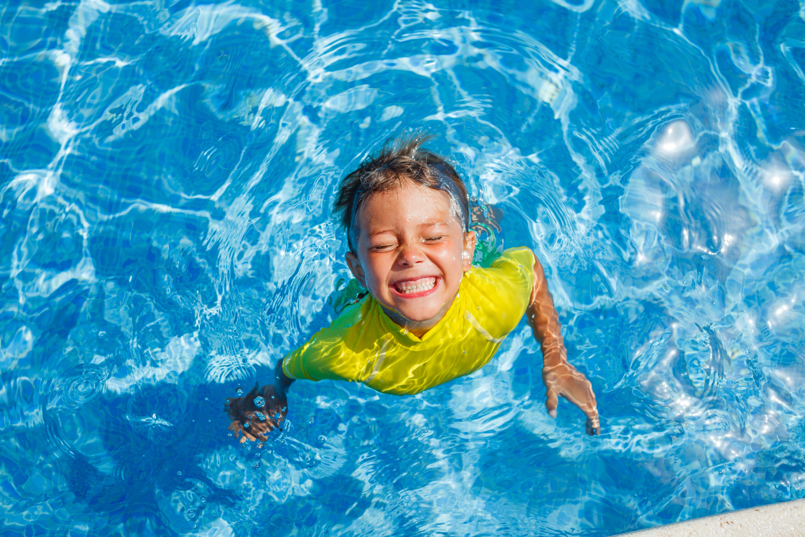 Child swimming in pool